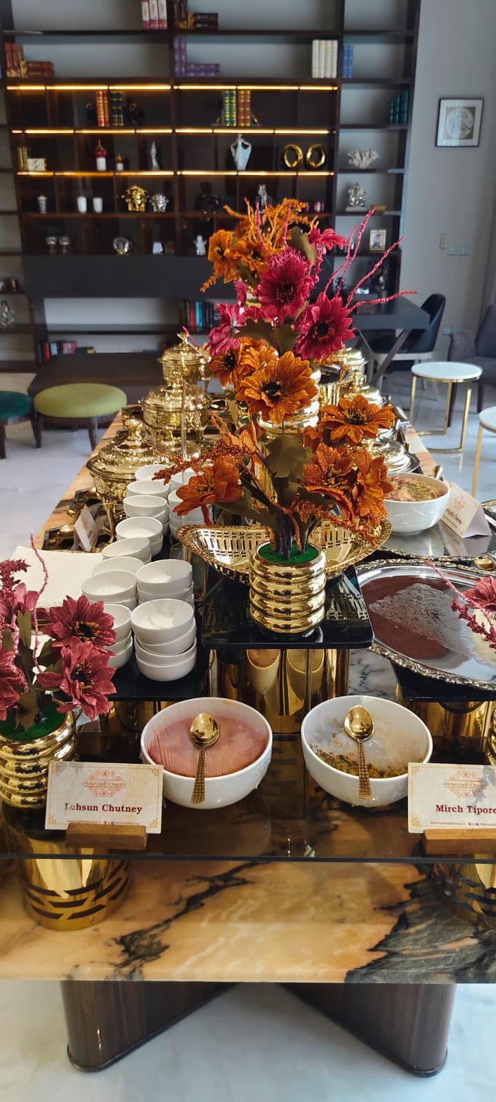 A Marwadi Khana buffet table with chutneys and serving bowls