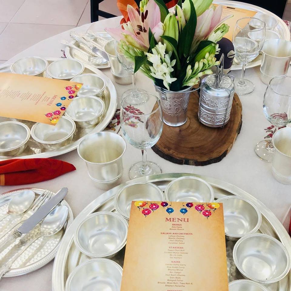 A welcome table set for a griha pravesh gathering